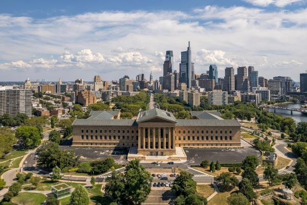 It's an aerial view of the Philadelphia Museum of Art with the city skyline in the background.